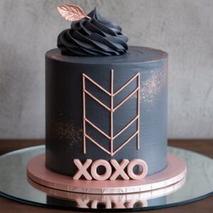 modern xoxo cake – geometric lines & copper accents